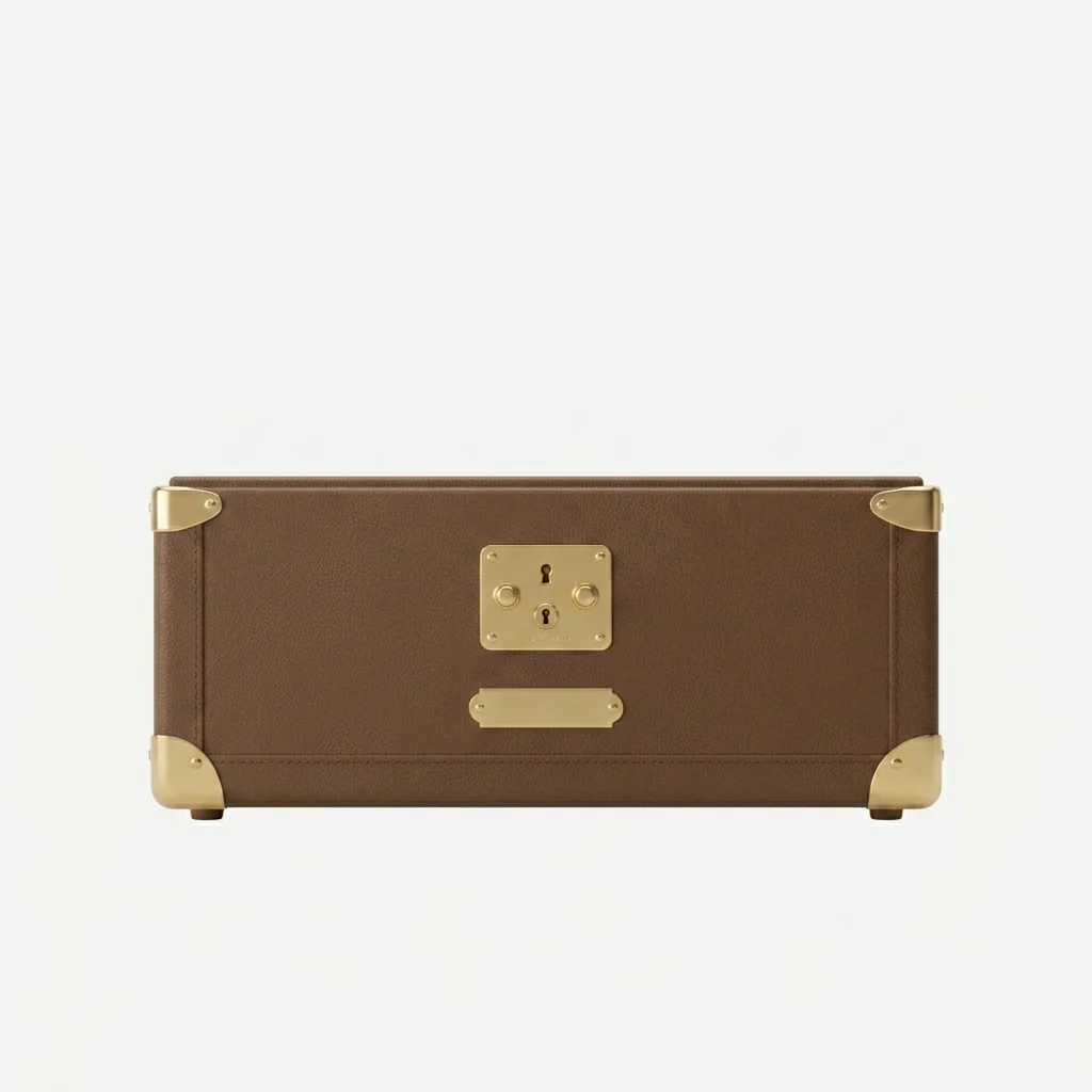Front elevation of the Monty cat bed showing the brass lock plate and engraved MONTY nameplate